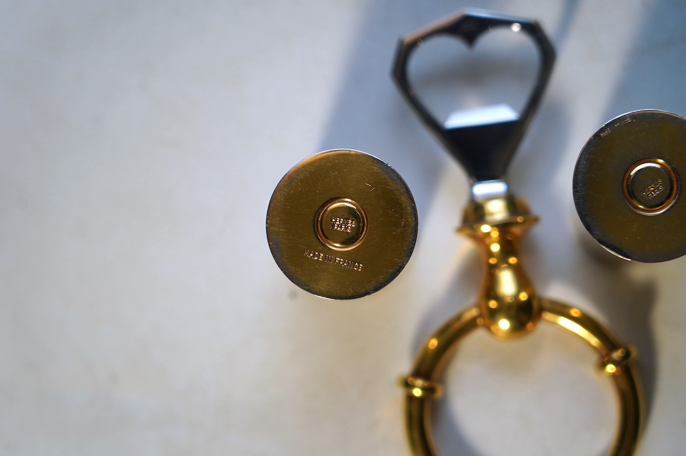 A pair of Hermes 'shotgun cartridge' handles and bottle opener. Condition - fair, some minor wear